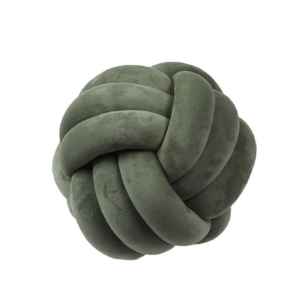 Coussin décoratif rond à motif boule en peluche nouée