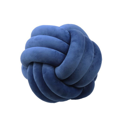 Coussin décoratif rond à motif boule en peluche nouée