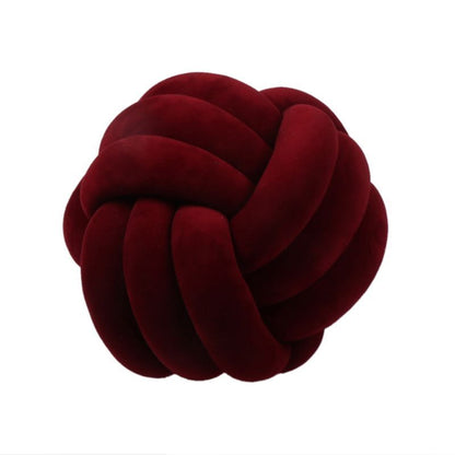 Coussin décoratif rond à motif boule en peluche nouée