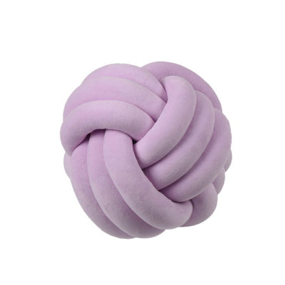 Coussin décoratif rond à motif boule en peluche nouée